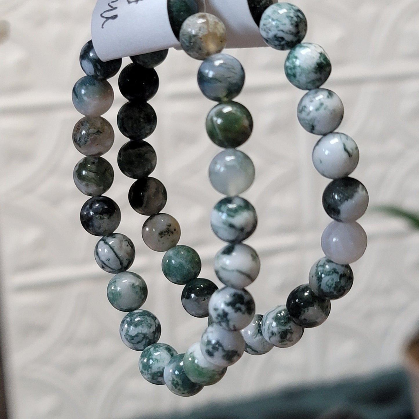 A cool, mossy stone that brings us to the heart of a northern forest, moss or tree agate helps us to connect with the land and all of the kindred souls which dwell in it.  Hand-strung on an elastic cord, there are no pesky clasps to mess with.  Just slide these on and you're ready to go.